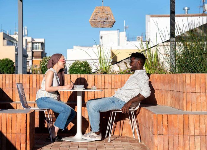 Coworkers having lunch on The Shed rooftop terrace